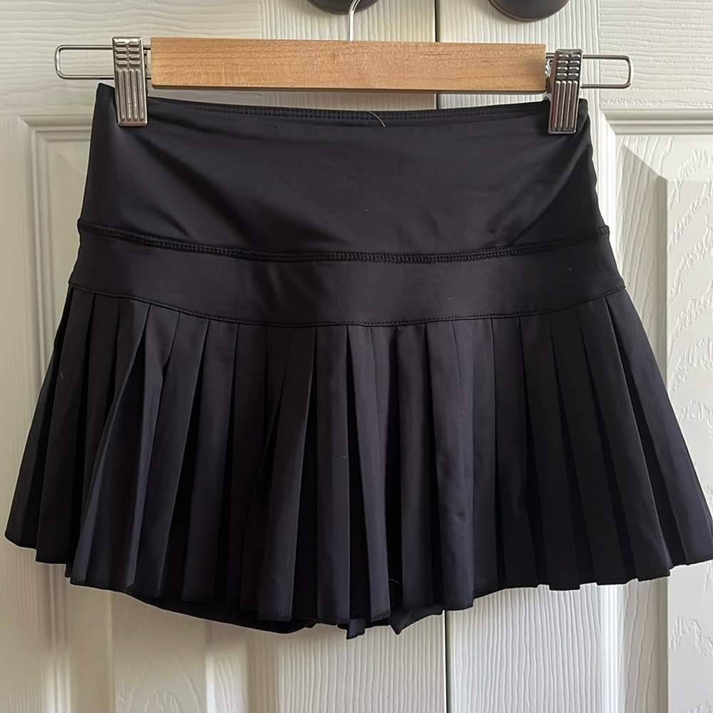 Black brand new gold hinge skirt. So comfortable and goes with anything!